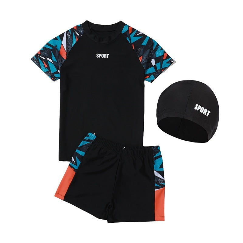 Creative Vault Marketplace boys two-piece black swim set with geometric sleeves, swim trunks, and matching swim cap.