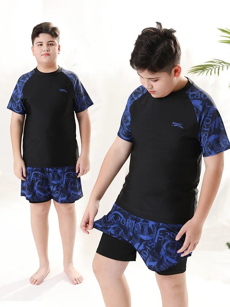 Creative Vault Marketplace boys' two-piece short-sleeve swim set in black and blue with a graphic print pattern