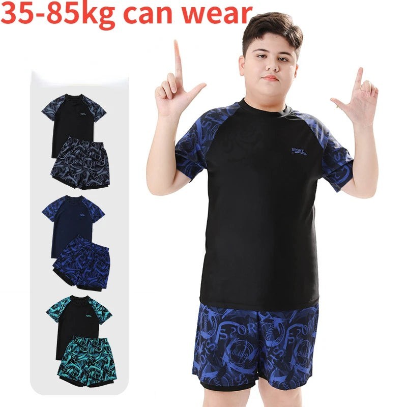 Creative Vault Marketplace boys' two-piece short-sleeve swim set with matching trunks and cap in blue and black patterns.