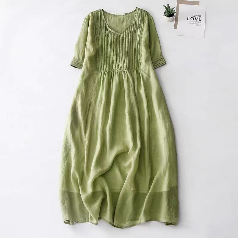 Creative Vault Marketplace green vintage midi dress in cotton linen with V-neck, half sleeves, and organ pleated bodice.