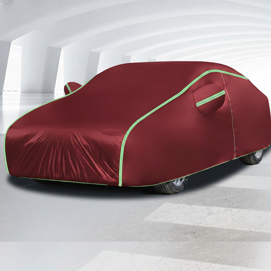Creative Vault Marketplace all-season maroon Oxford cloth car cover with reflective piping in a bright studio setting.