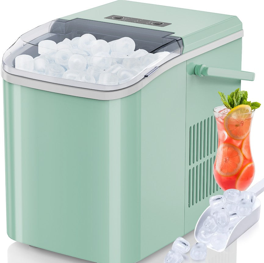 Creative Vault Marketplace portable mint green countertop ice maker with transparent lid, ice scoop, and fruit drink.
