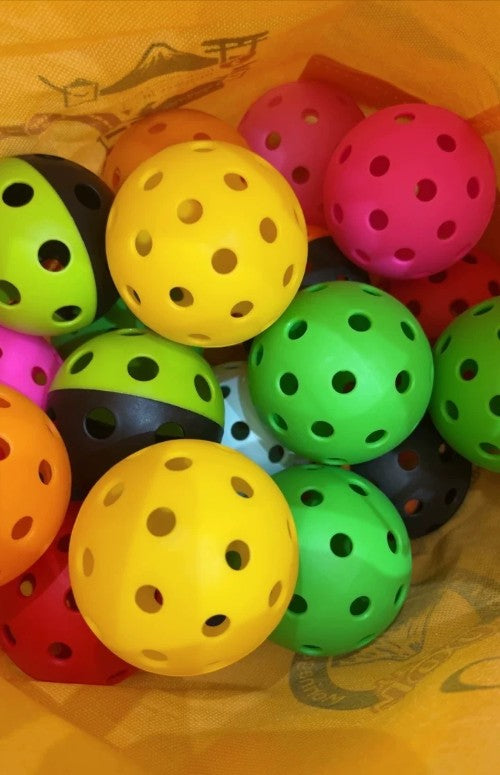 Creative Vault Marketplace multi-colored pickleball set with 40-hole design for indoor and outdoor play