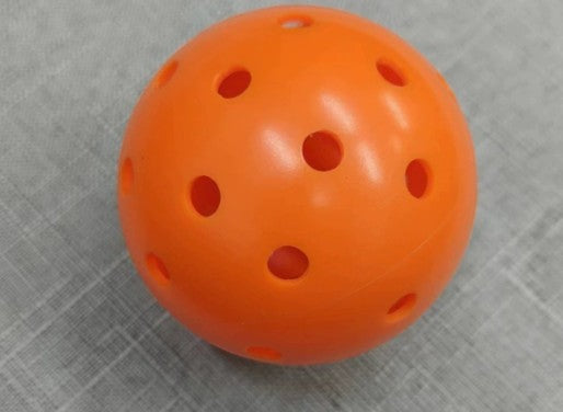 Creative Vault Marketplace orange pickleball with 40 holes for indoor and outdoor play