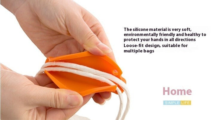 Creative Vault Marketplace orange silicone grocery bag grip handle being used to carry multiple shopping bag cords