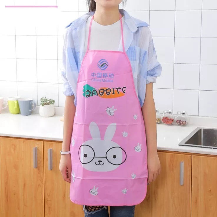 Creative Vault Marketplace pink waterproof PVC kitchen apron featuring a cute rabbit cartoon design worn by a person