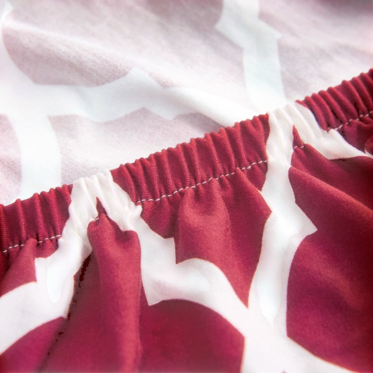 Creative Vault Marketplace red and white floral elastic sofa cover made from a stretchy polyester and spandex blend