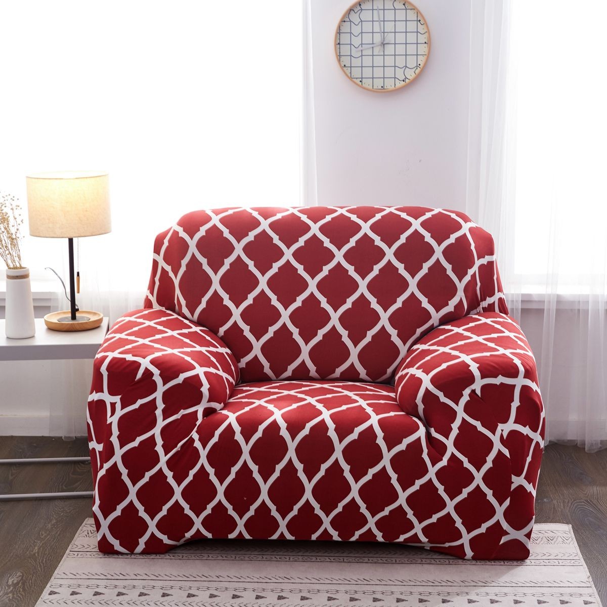 Creative Vault Marketplace red elastic sofa chair cover with a white geometric lattice pattern in a bright living room