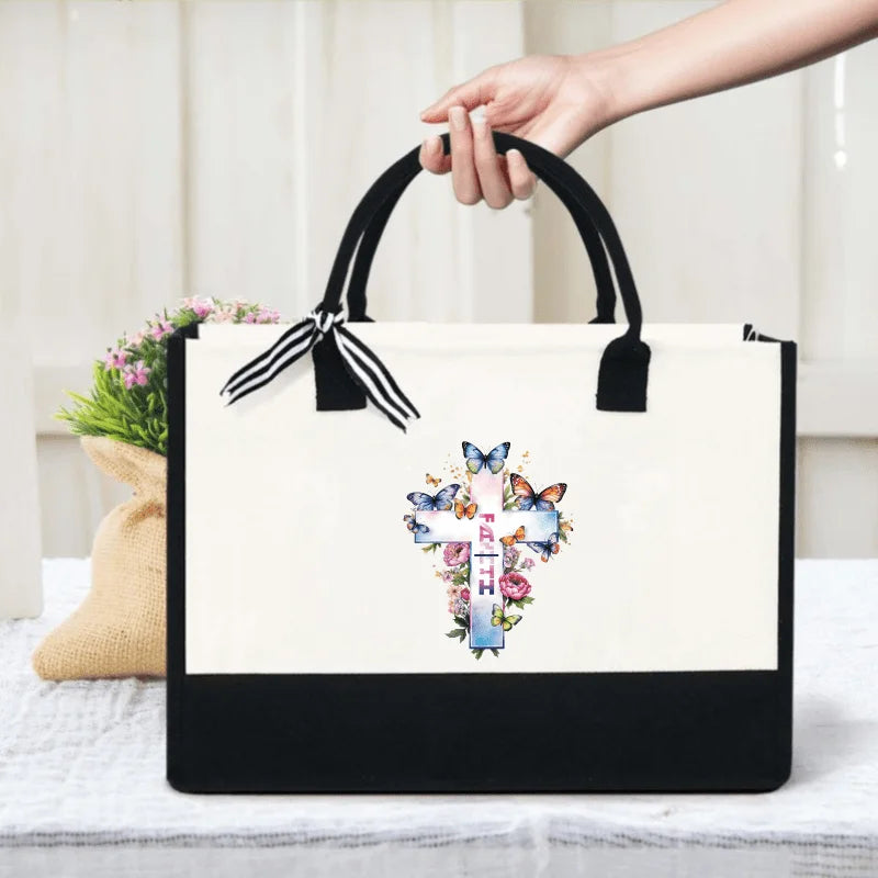 Cream and black cross of faith with butterfly and flower print canvas tote, suitable for church and daily use by Creative Vault Marketplace