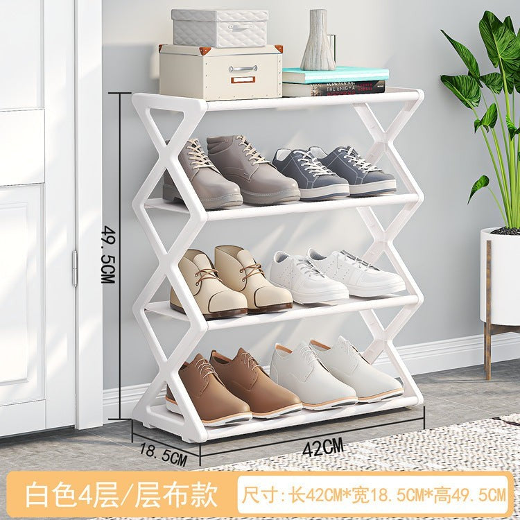 Creative Vault Marketplace white metal X-frame shoe rack with four tiers holding various pairs of shoes in a room